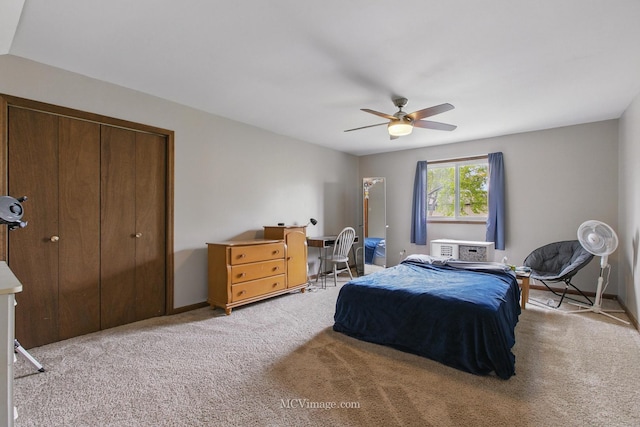 bedroom featuring a closet, carpet flooring, baseboards, and ceiling fan