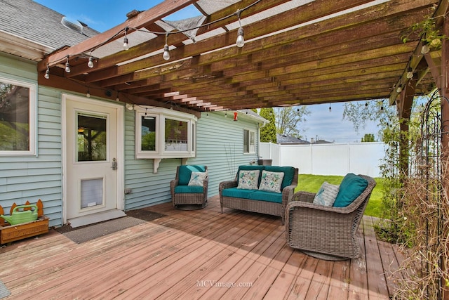 deck with a fenced backyard, a pergola, and outdoor lounge area