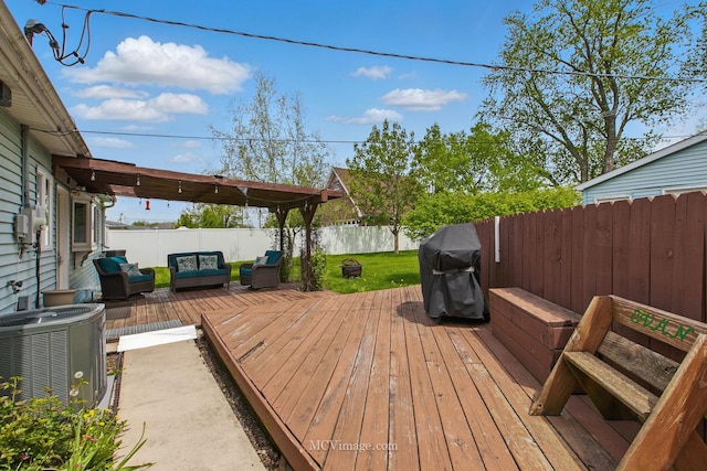 deck featuring a lawn, a fenced backyard, outdoor lounge area, and cooling unit