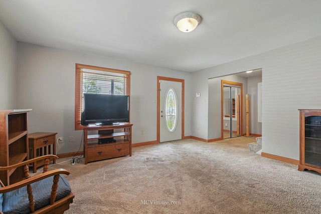 living room with carpet floors and baseboards
