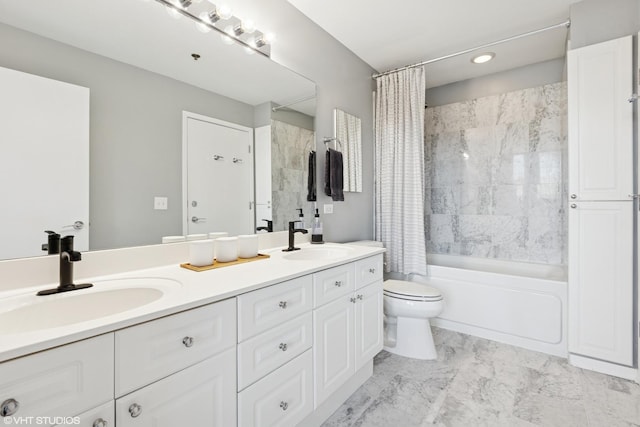 full bathroom with double vanity, a sink, shower / bath combo, and toilet