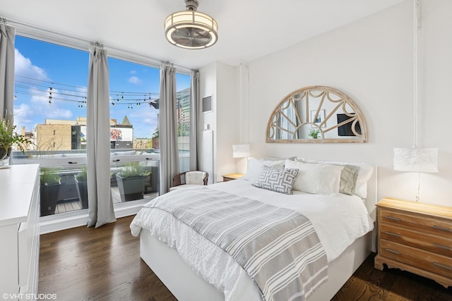bedroom featuring dark wood-style floors