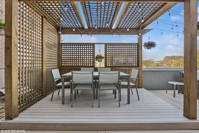 wooden terrace featuring a pergola and outdoor dining space