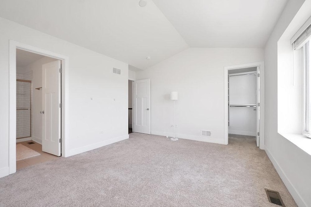 4133 Calder Ln, Aurora, IL 60504 - unfurnished bedroom featuring visible vents, light carpet, and vaulted ceiling