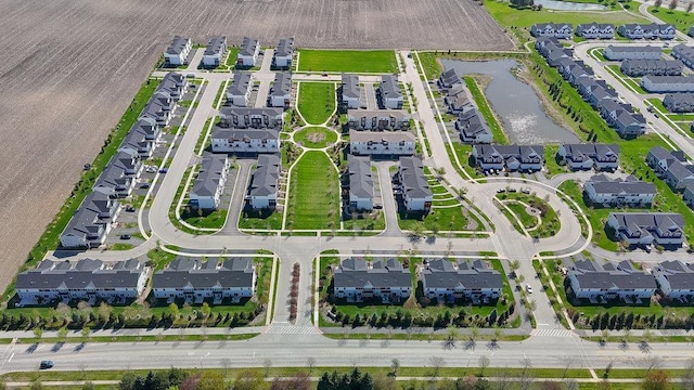 aerial view featuring a water view and a residential view