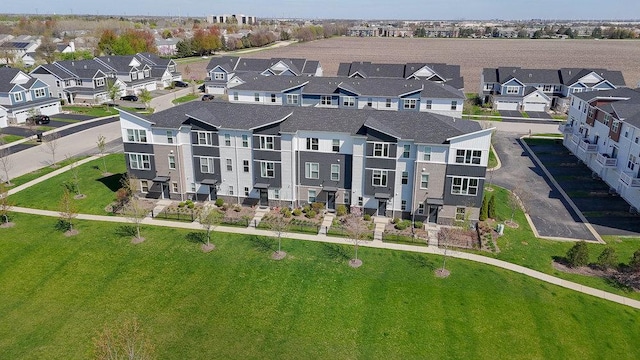 birds eye view of property with a residential view