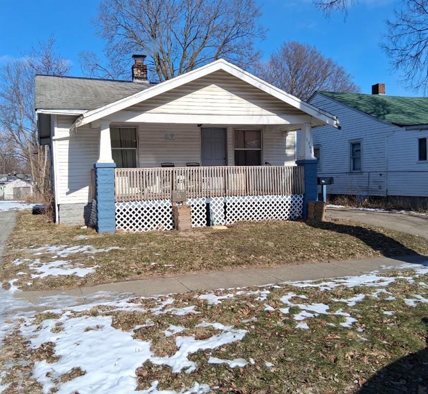 1360 E Locust St, Decatur, IL 62521 - bungalow-style home featuring covered porch and a chimney
