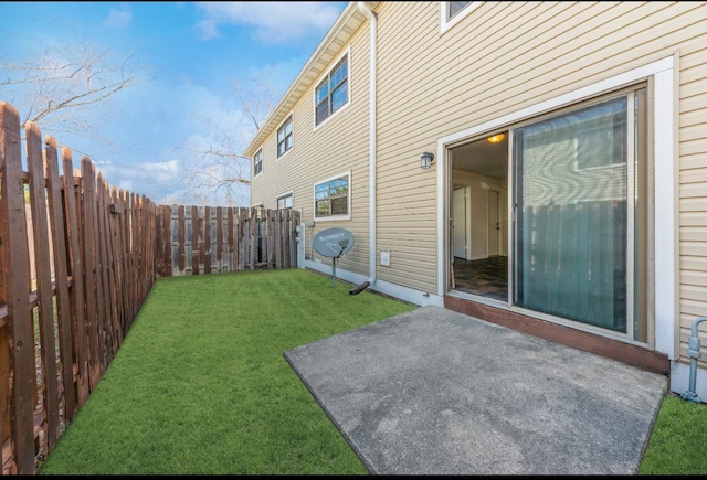 view of yard featuring a patio and a fenced backyard