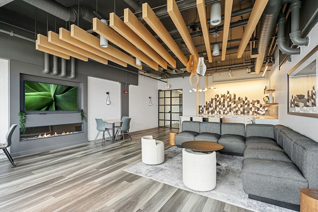1530 S State St Unit 523, Chicago, IL 60605 - living area with a glass covered fireplace and wood finished floors