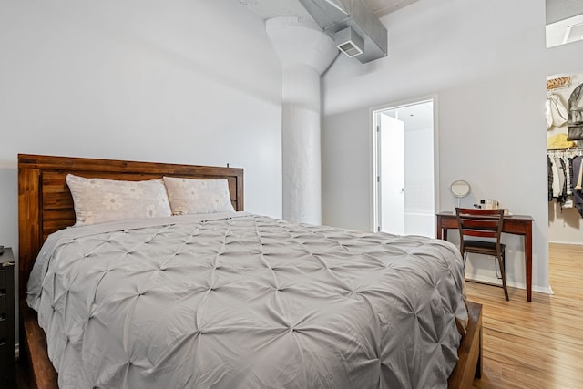 1530 S State St Unit 523, Chicago, IL 60605 - bedroom with ornate columns and wood finished floors