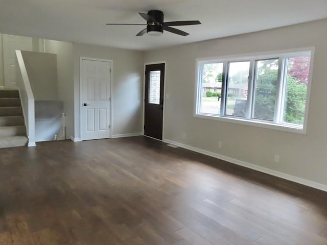 302 Windsor Dr, Ottawa, IL 61350 - foyer entrance with baseboards, dark wood finished floors, ceiling fan, and stairway