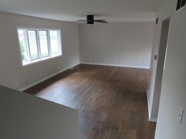 302 Windsor Dr, Ottawa, IL 61350 - empty room featuring dark wood-style floors, ceiling fan, and baseboards
