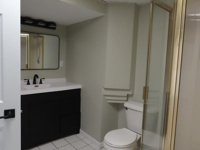 302 Windsor Dr, Ottawa, IL 61350 - full bathroom with toilet, vanity, tile patterned flooring, and a stall shower