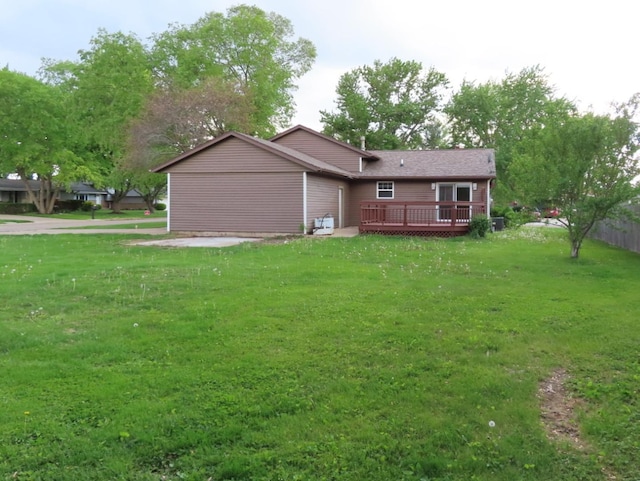 302 Windsor Dr, Ottawa, IL 61350 - back of house featuring a wooden deck and a lawn