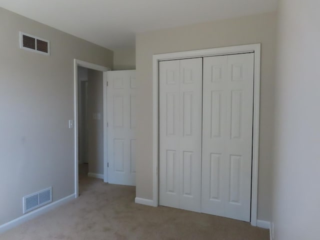 302 Windsor Dr, Ottawa, IL 61350 - unfurnished bedroom featuring light carpet, a closet, and baseboards