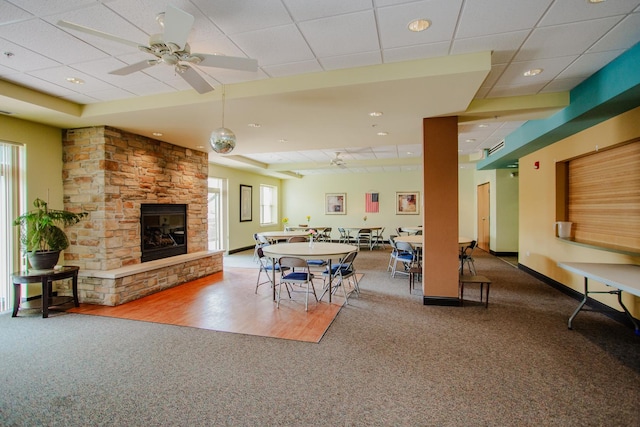 9355 Irving Park Rd Unit 510, Schiller Park, IL 60176 - dining space featuring carpet floors, a drop ceiling, a healthy amount of sunlight, and a fireplace