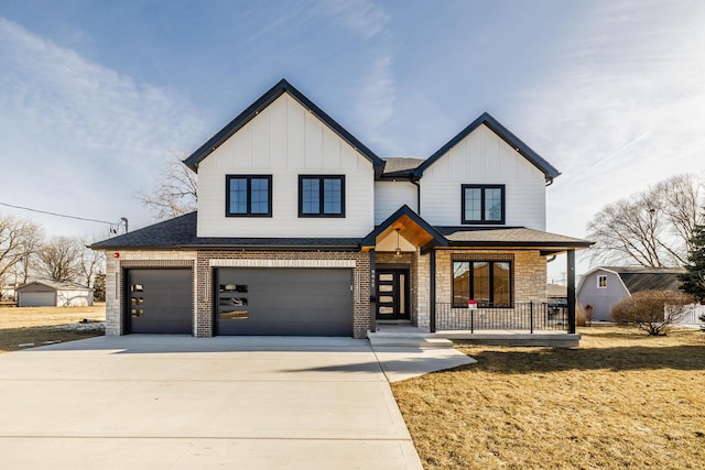 view of front of home with covered porch, an attached garage, board and batten siding, and driveway