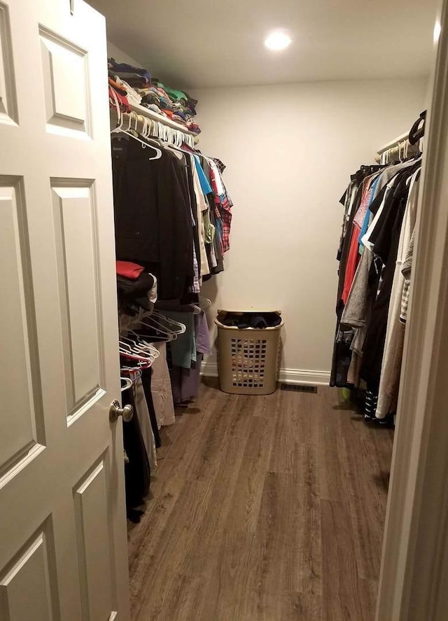 10455 S Forest Ave, Chicago, IL 60628 - spacious closet featuring wood finished floors