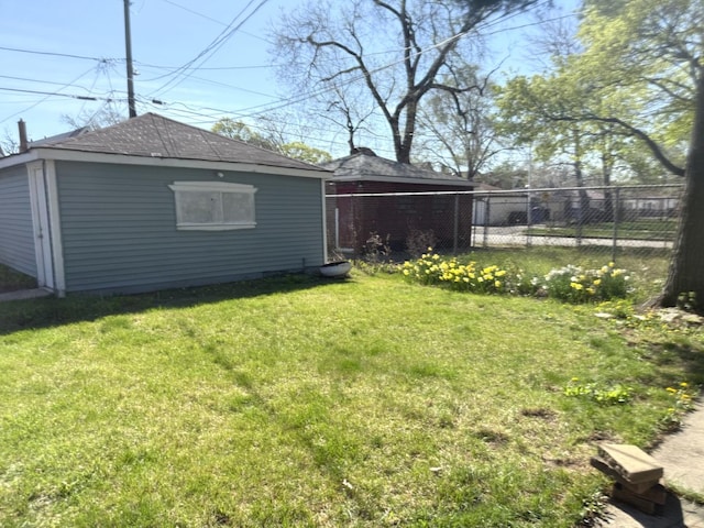 10455 S Forest Ave, Chicago, IL 60628 - view of yard with fence and an outbuilding
