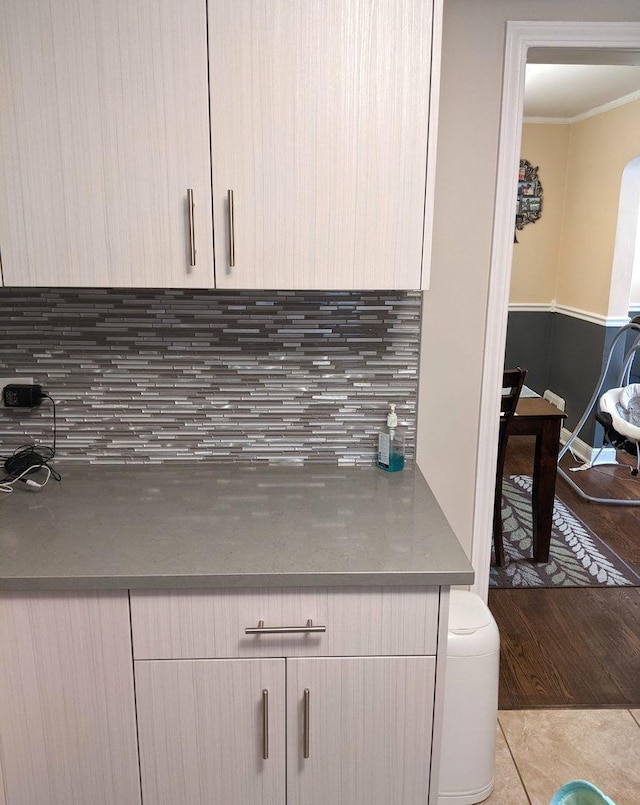 10455 S Forest Ave, Chicago, IL 60628 - room details featuring crown molding, wood finished floors, and tasteful backsplash