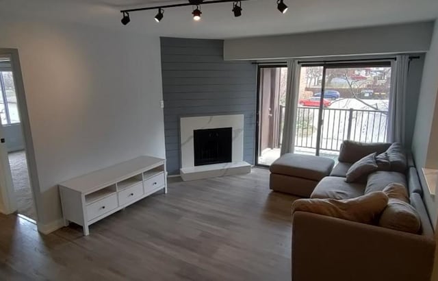 55 W 64th St Unit 202, Westmont, IL 60559 - living room featuring track lighting, wood finished floors, and a fireplace