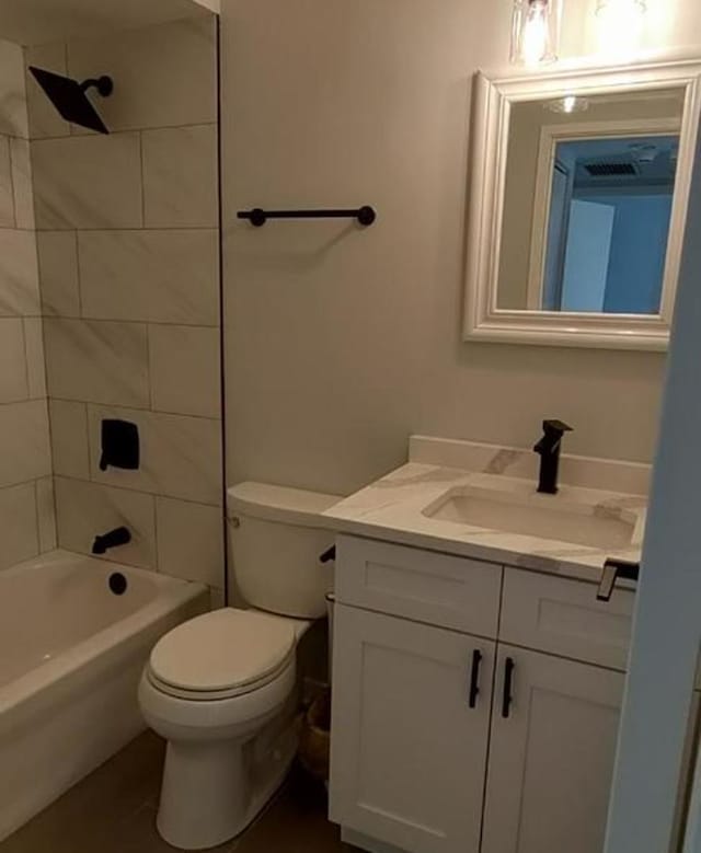 55 W 64th St Unit 202, Westmont, IL 60559 - bathroom featuring vanity, washtub / shower combination, tile patterned flooring, and toilet