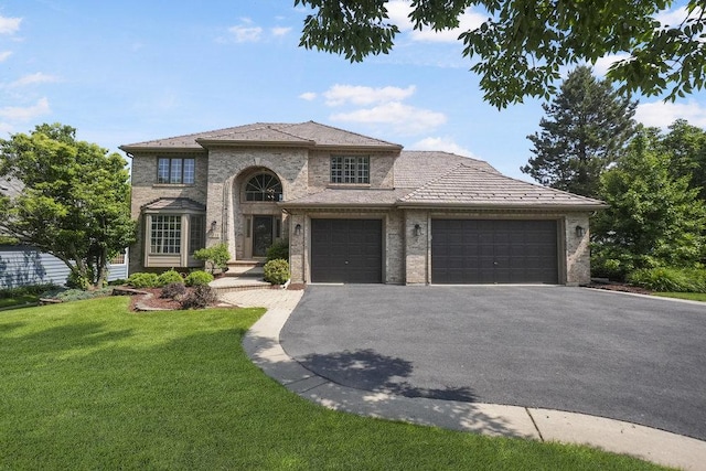 1872 River Ridge Circle, Naperville, IL 60565 - french country style house with an attached garage, asphalt driveway, a front lawn, and brick siding