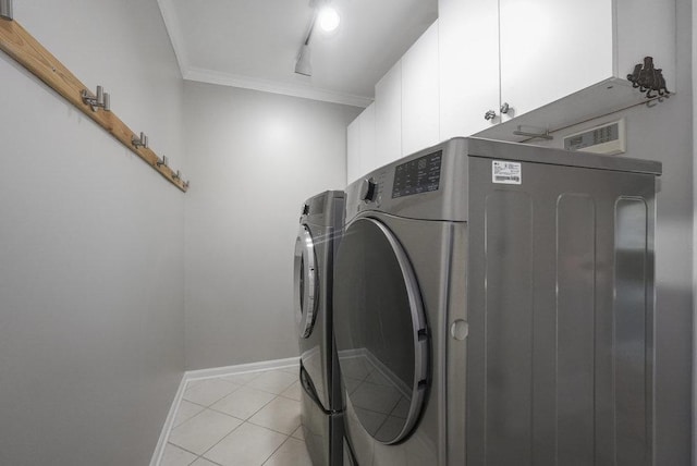 1872 River Ridge Circle, Naperville, IL 60565 - washroom featuring cabinet space, washer and dryer, ornamental molding, light tile patterned floors, and baseboards