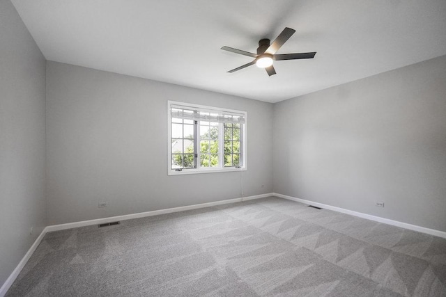 1872 River Ridge Circle, Naperville, IL 60565 - spare room featuring a ceiling fan, light colored carpet, and baseboards
