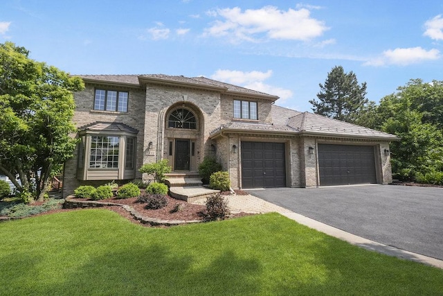 1872 River Ridge Circle, Naperville, IL 60565 - view of front of property with asphalt driveway, an attached garage, a front yard, and brick siding