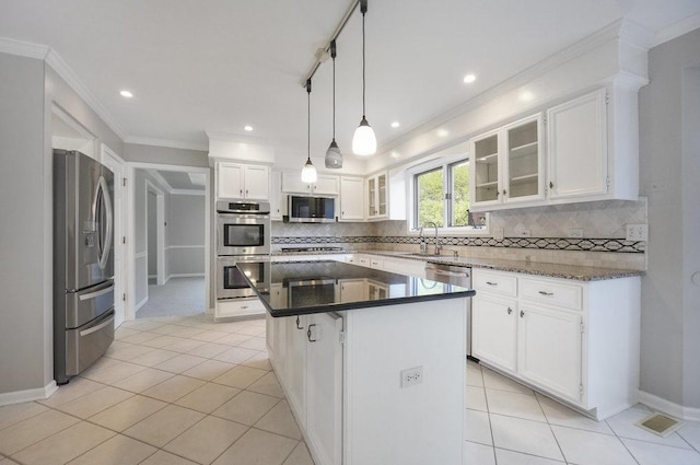 1872 River Ridge Circle, Naperville, IL 60565 - kitchen featuring stainless steel appliances, backsplash, white cabinetry, a sink, and a center island