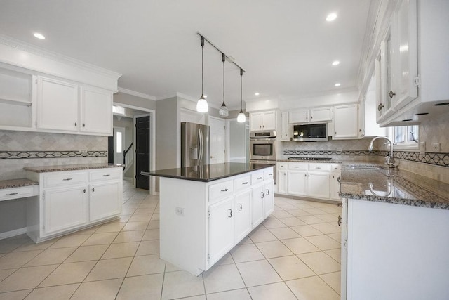 1872 River Ridge Circle, Naperville, IL 60565 - kitchen with appliances with stainless steel finishes, a sink, backsplash, a kitchen island, and ornamental molding