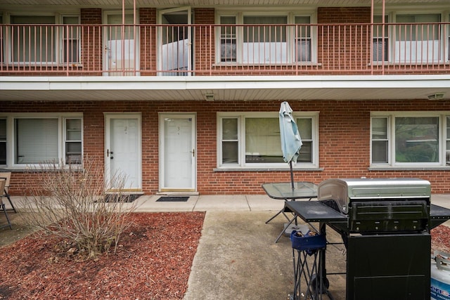 165 Dover Dr Unit 3, Des Plaines, IL 60018 - property entrance featuring brick siding and a balcony