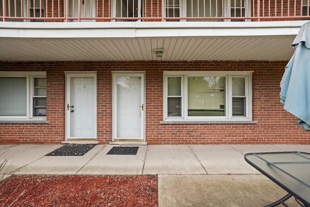 165 Dover Dr Unit 3, Des Plaines, IL 60018 - doorway to property featuring brick siding and a balcony