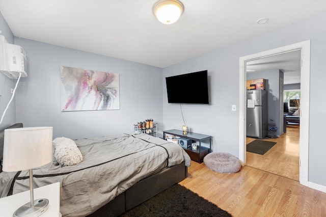 165 Dover Dr Unit 3, Des Plaines, IL 60018 - bedroom featuring freestanding refrigerator and light wood-style flooring