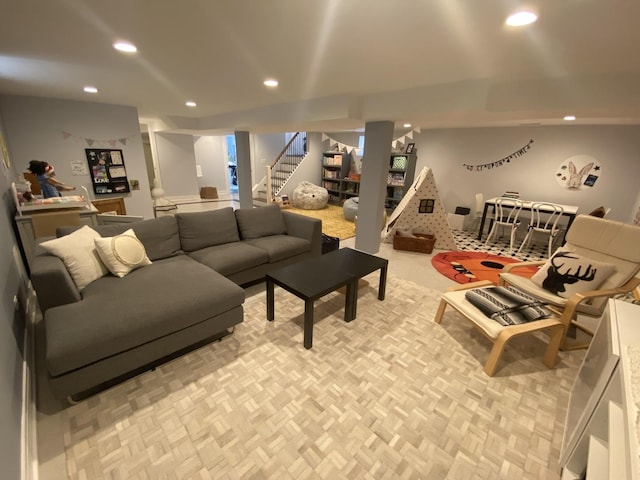 living area with stairs and recessed lighting