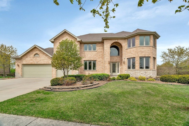 view of front of house with concrete driveway, brick siding, a front yard, and a garage