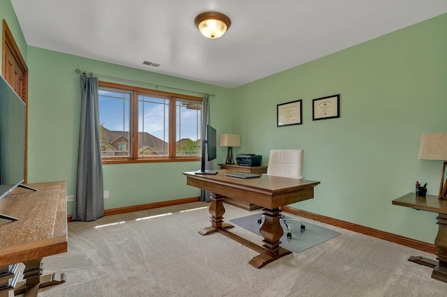 office with baseboards, visible vents, and carpet