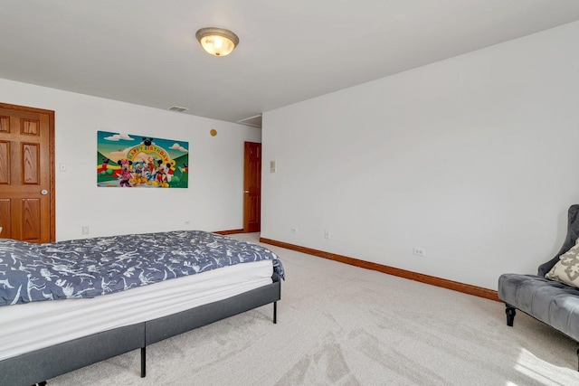 bedroom featuring baseboards, carpet flooring, and visible vents