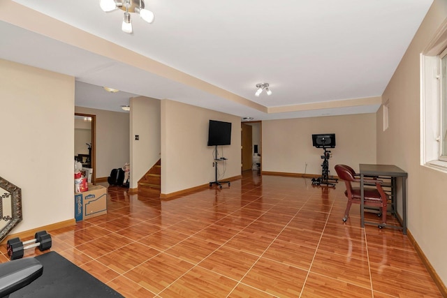 workout room with baseboards