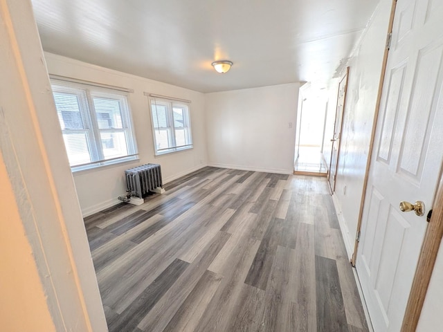 7549 S Perry Ave, Chicago, IL 60620 - unfurnished room with radiator, baseboards, and wood finished floors