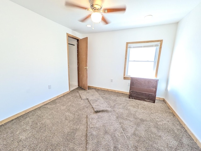 7549 S Perry Ave, Chicago, IL 60620 - unfurnished bedroom with baseboards, a ceiling fan, and carpet flooring