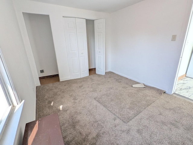 7549 S Perry Ave, Chicago, IL 60620 - unfurnished bedroom featuring carpet flooring, baseboards, and a closet