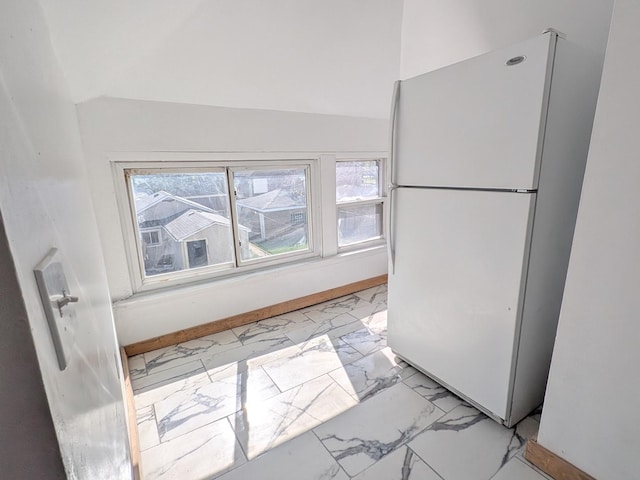 7549 S Perry Ave, Chicago, IL 60620 - kitchen featuring baseboards, plenty of natural light, freestanding refrigerator, and marble finish floor