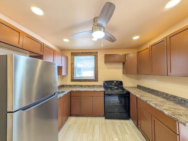 7549 S Perry Ave, Chicago, IL 60620 - kitchen featuring brown cabinetry, freestanding refrigerator, ceiling fan, recessed lighting, and black range with gas cooktop