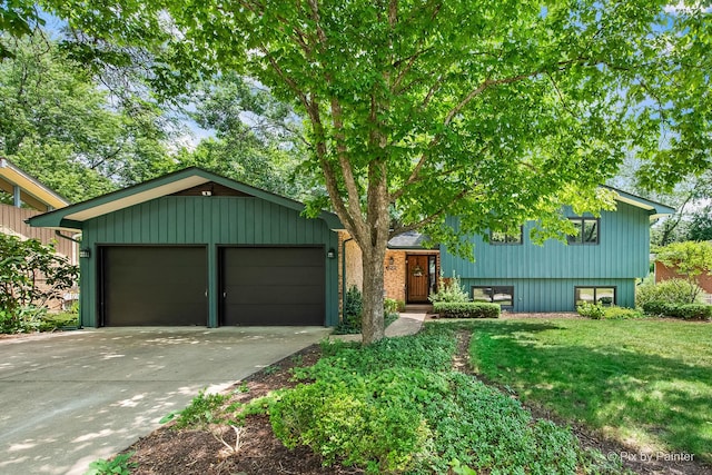 622 Katherine St, Saint Charles, IL 60174 - split level home with driveway, an attached garage, and a front yard