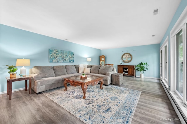 622 Katherine St, Saint Charles, IL 60174 - living room featuring a baseboard heating unit and wood finished floors