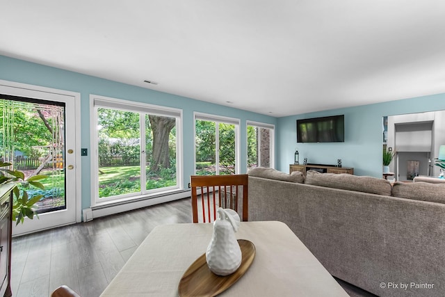 622 Katherine St, Saint Charles, IL 60174 - dining room with a baseboard heating unit, wood finished floors, and bar with sink