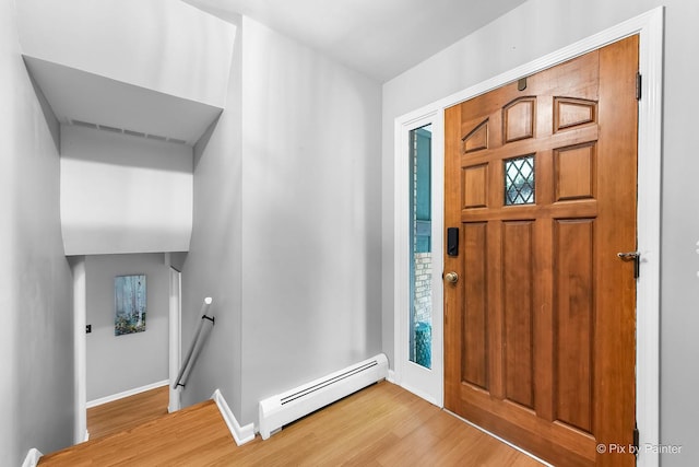 622 Katherine St, Saint Charles, IL 60174 - foyer entrance with a baseboard heating unit and wood finished floors