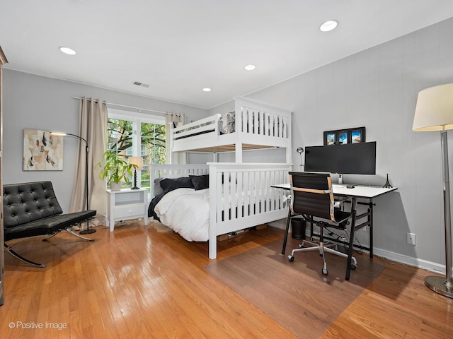 bedroom featuring baseboards, recessed lighting, visible vents, and hardwood / wood-style flooring